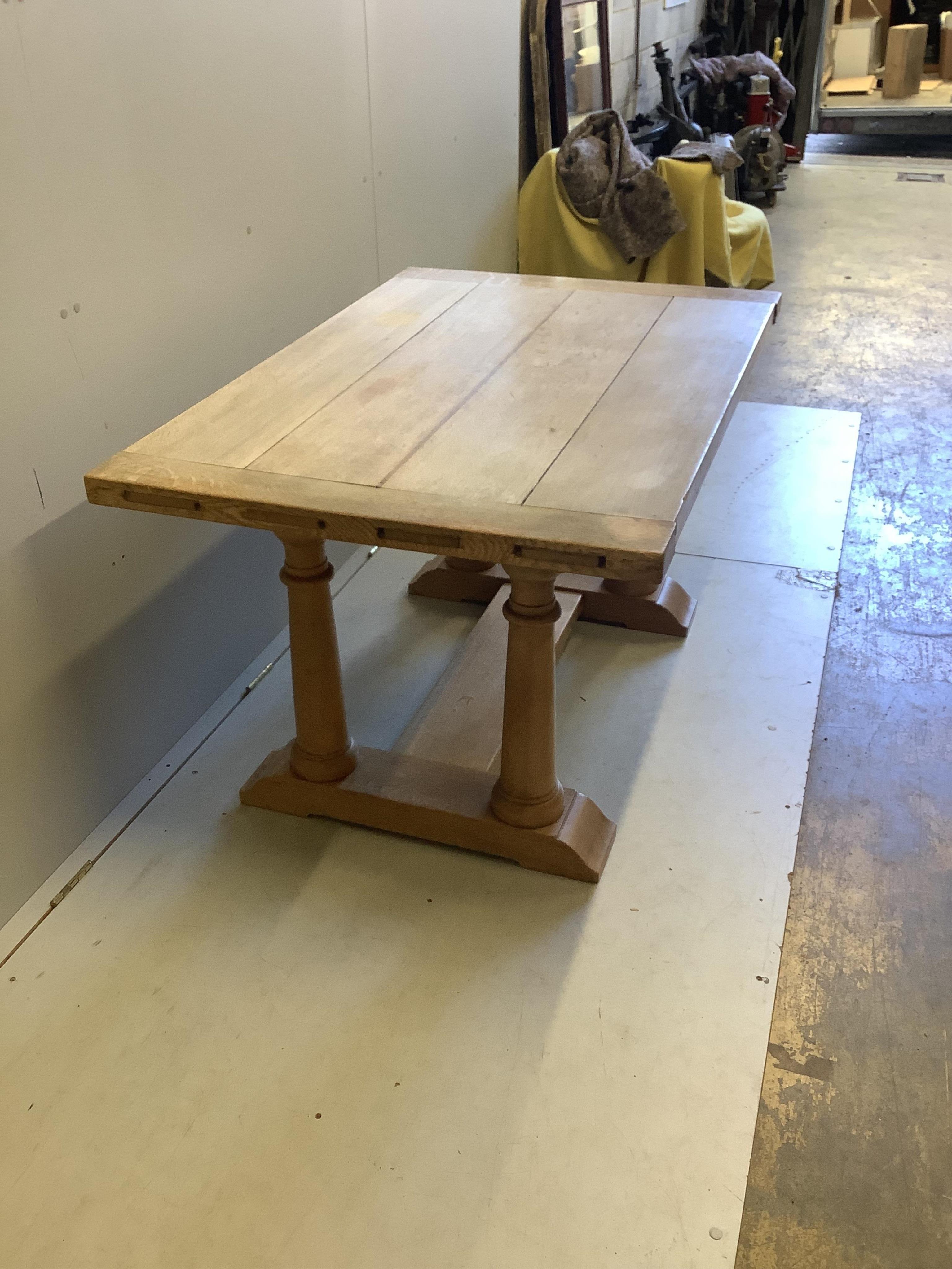 An 18th century style rectangular bleached oak refectory dining table, width 129cm, depth 86cm, height 73cm. Condition - fair